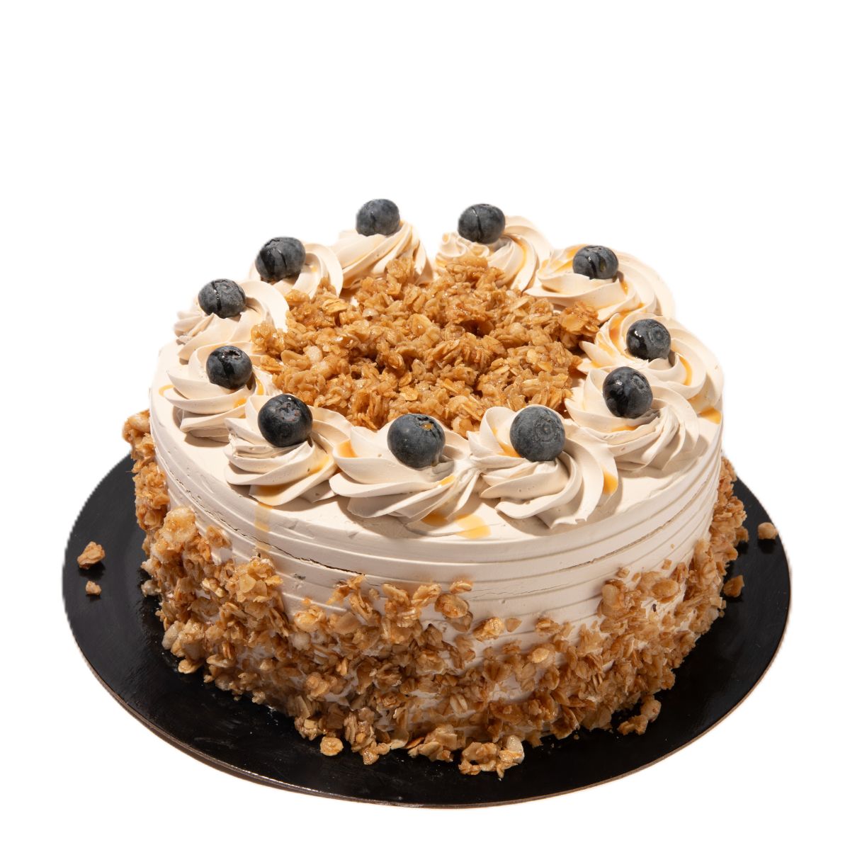 Blueberry coffee crunch cake with cream frosting, granola crumble topping, and fresh blueberries on a round layered cake.